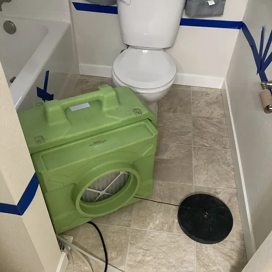 Dehumidifier set up after a bathroom leak, Greater Seattle