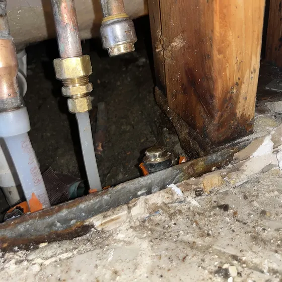 Corroded supply lines behind a wall, San Bernardino Valley