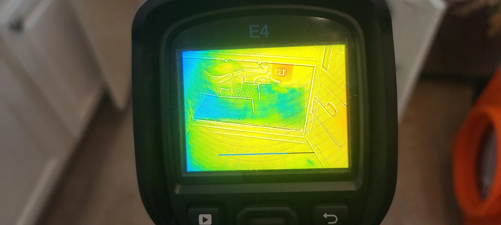 Thermal camera showing moisture behind a wall