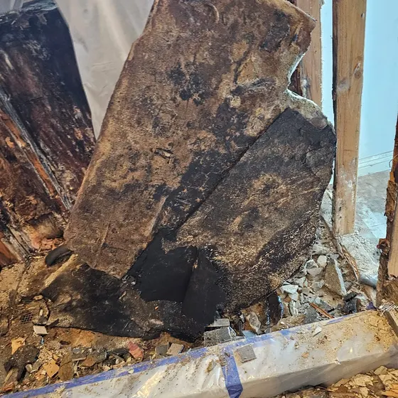 Mold-damaged board pulled from a wall, South Bay