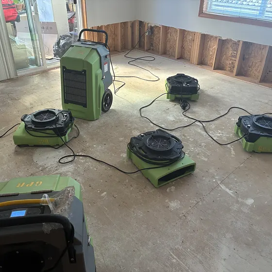 Air movers and dehumidifier on a bare subfloor, Greater Seattle