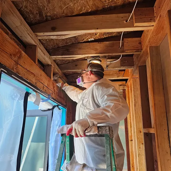 Cleaning exposed framing in containment, San Gabriel Valley