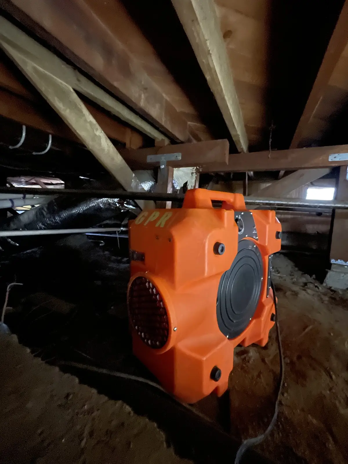 Air mover drying a crawl space