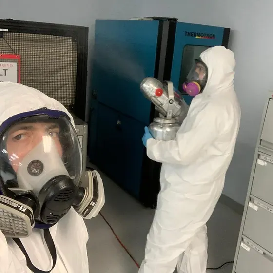 Technicians in full PPE before sanitizing, South Bay