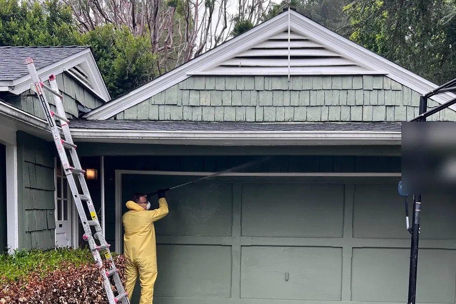 Wind-lifted shingles on a two-story