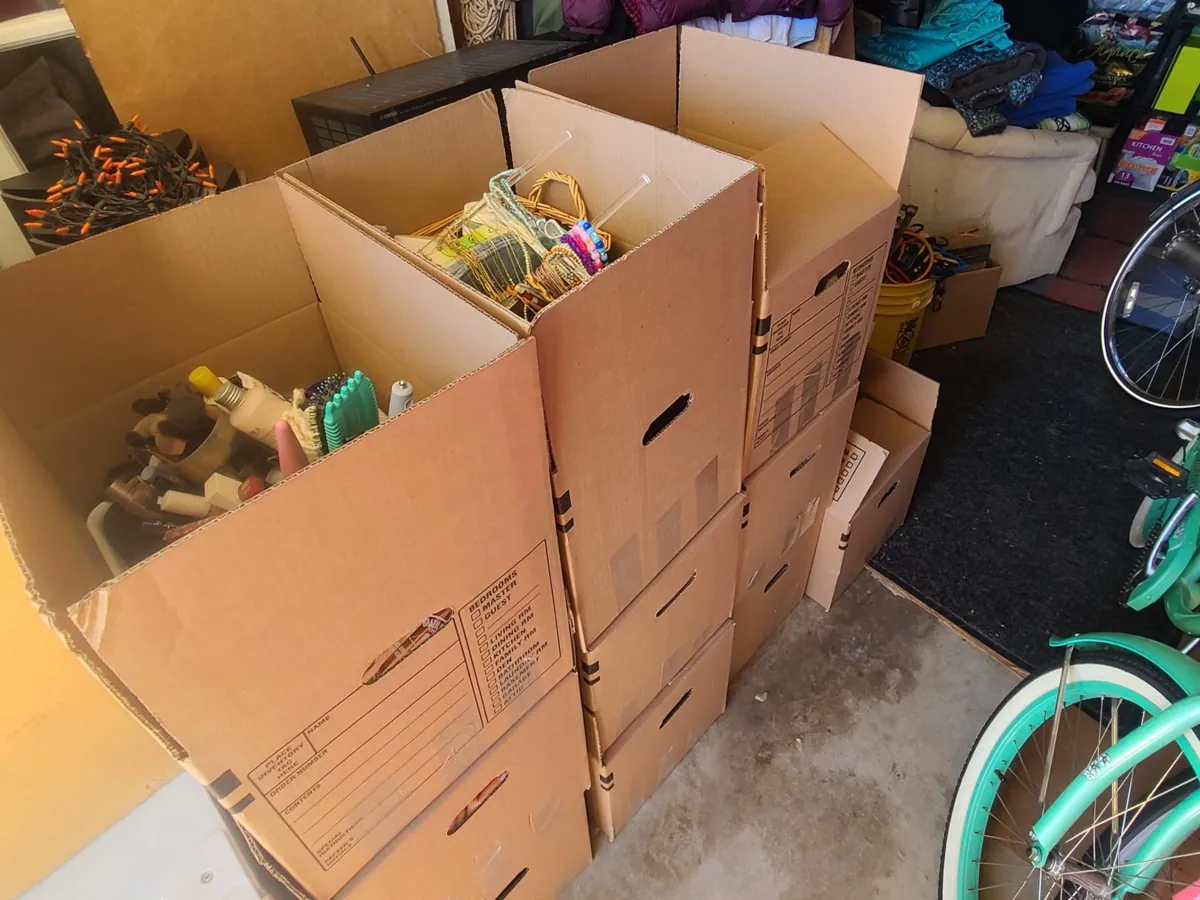 Crew packing household contents into boxes