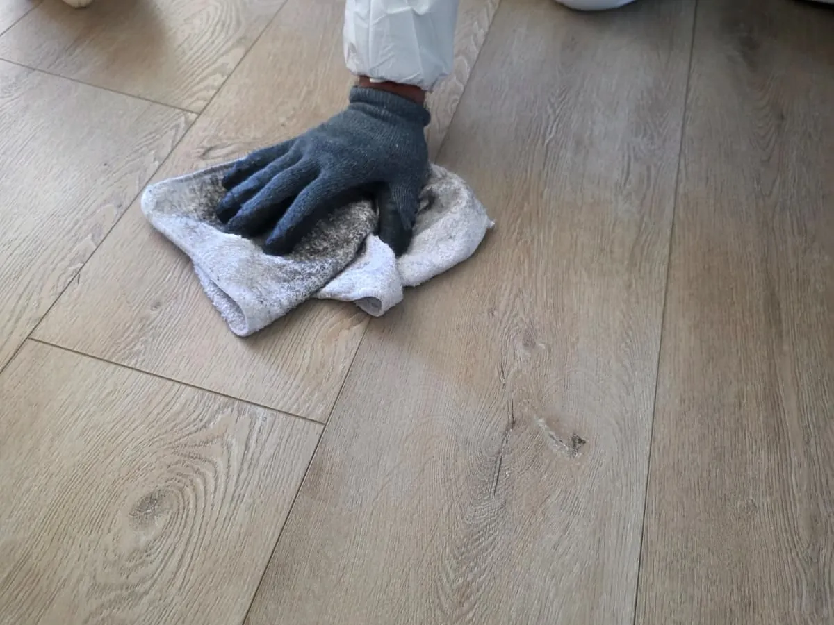 Smoke-damaged room being cleaned