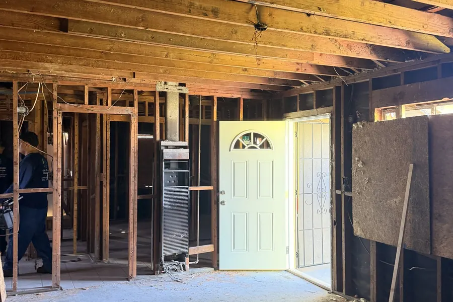 Vacant home broken into and damaged