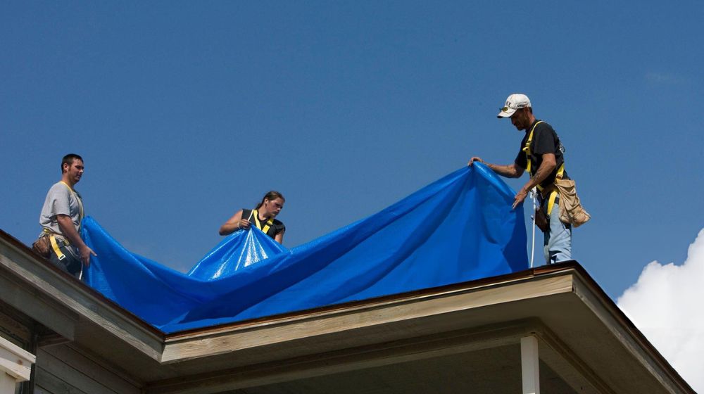 Installing a Blue Roof Tarp from FEMA - Green Planet Restoration