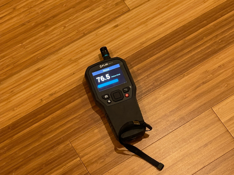 Pinless Moisture Meter on Flooring - Green Planet Restoration Pinless Moisture Meter on Flooring - Green Planet Restoration