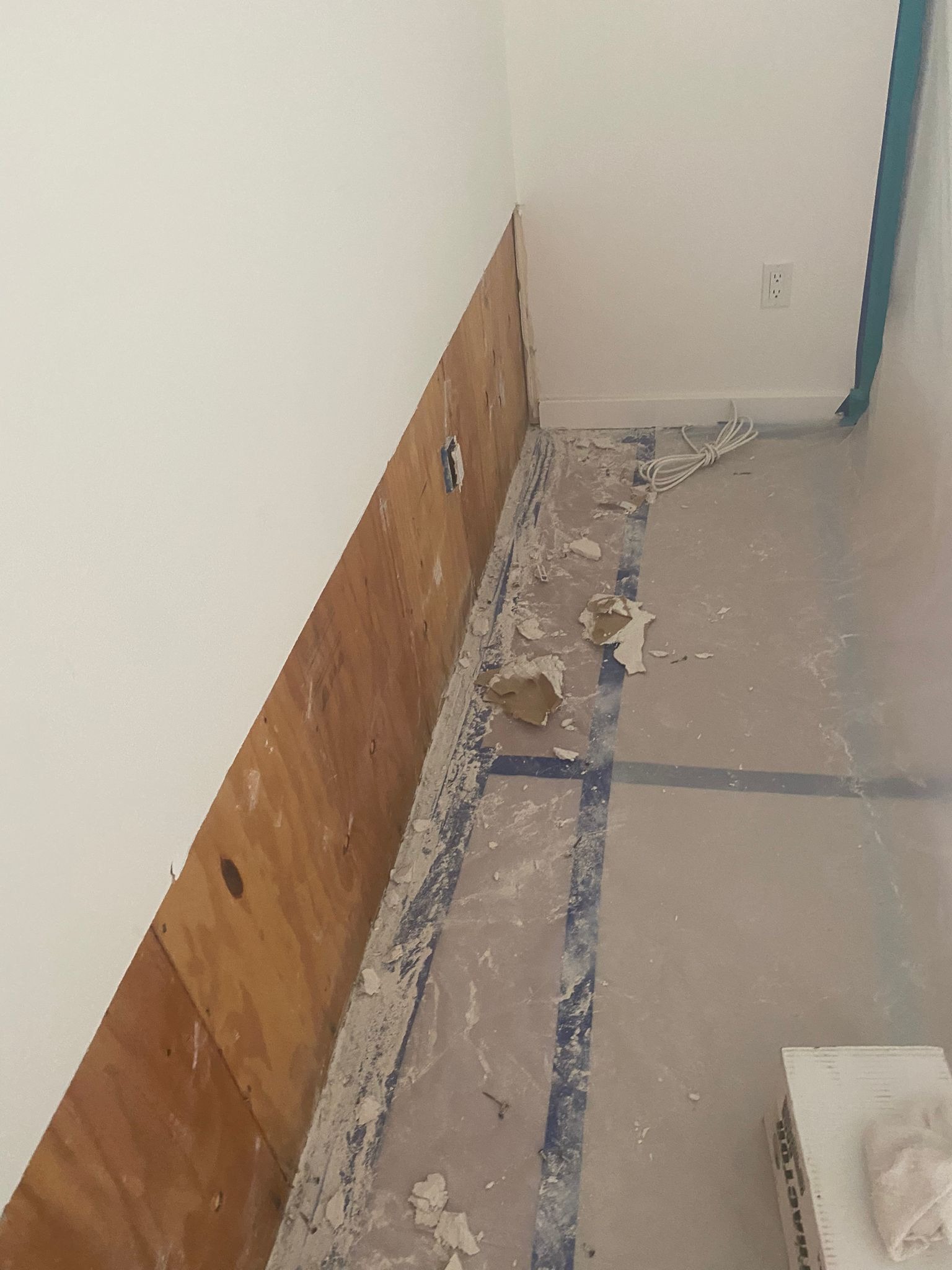 Exposed lower wall cavity during water mitigation in Central Los Angeles