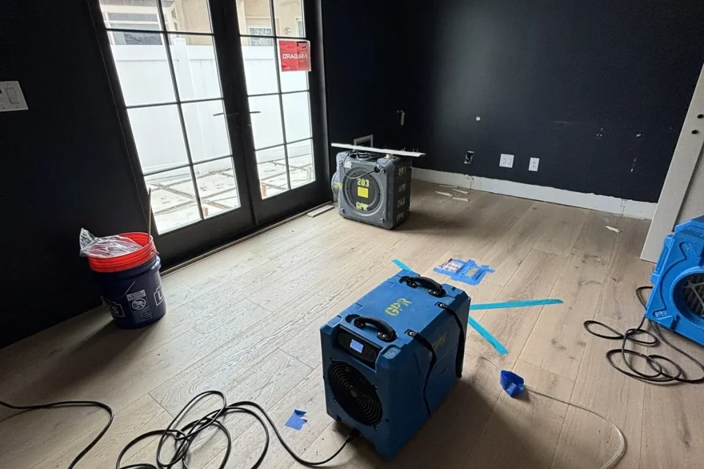 Drying equipment set up in a water-damaged room