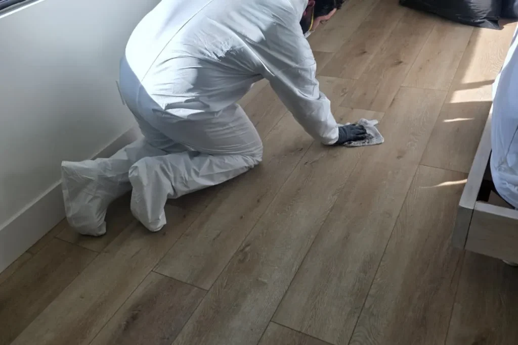 Wiping down floors during smoke cleanup
