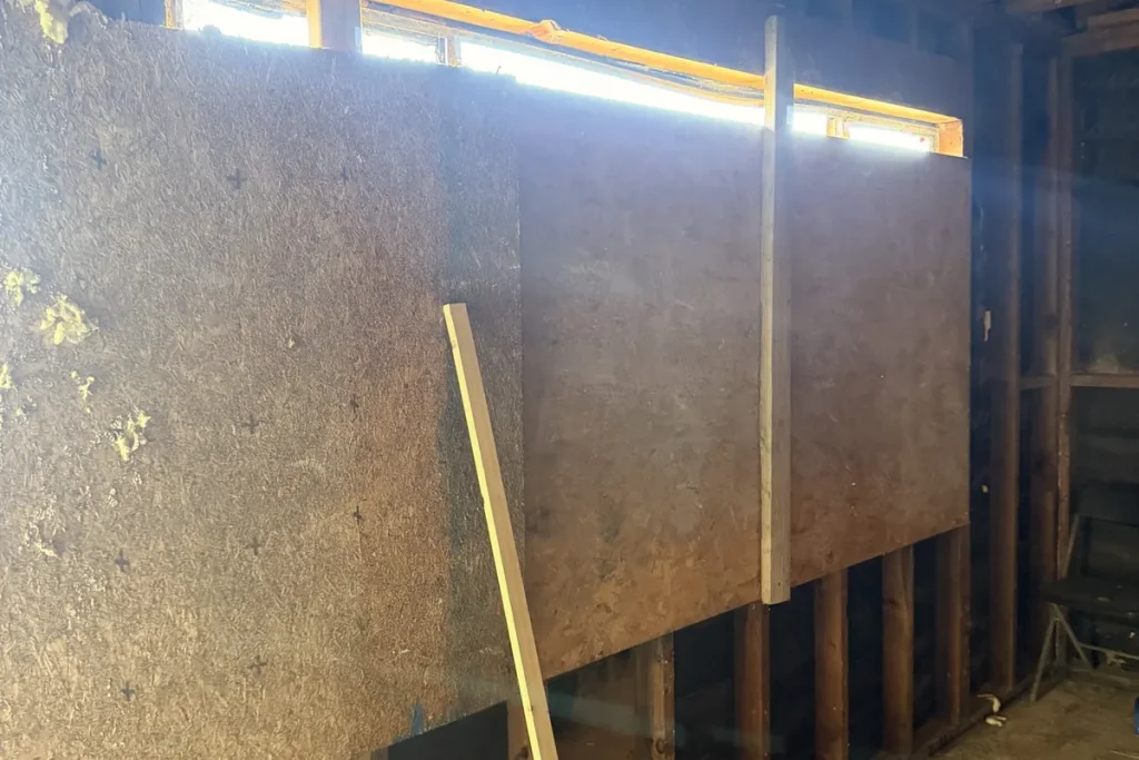 Plywood secured over a window opening from inside
