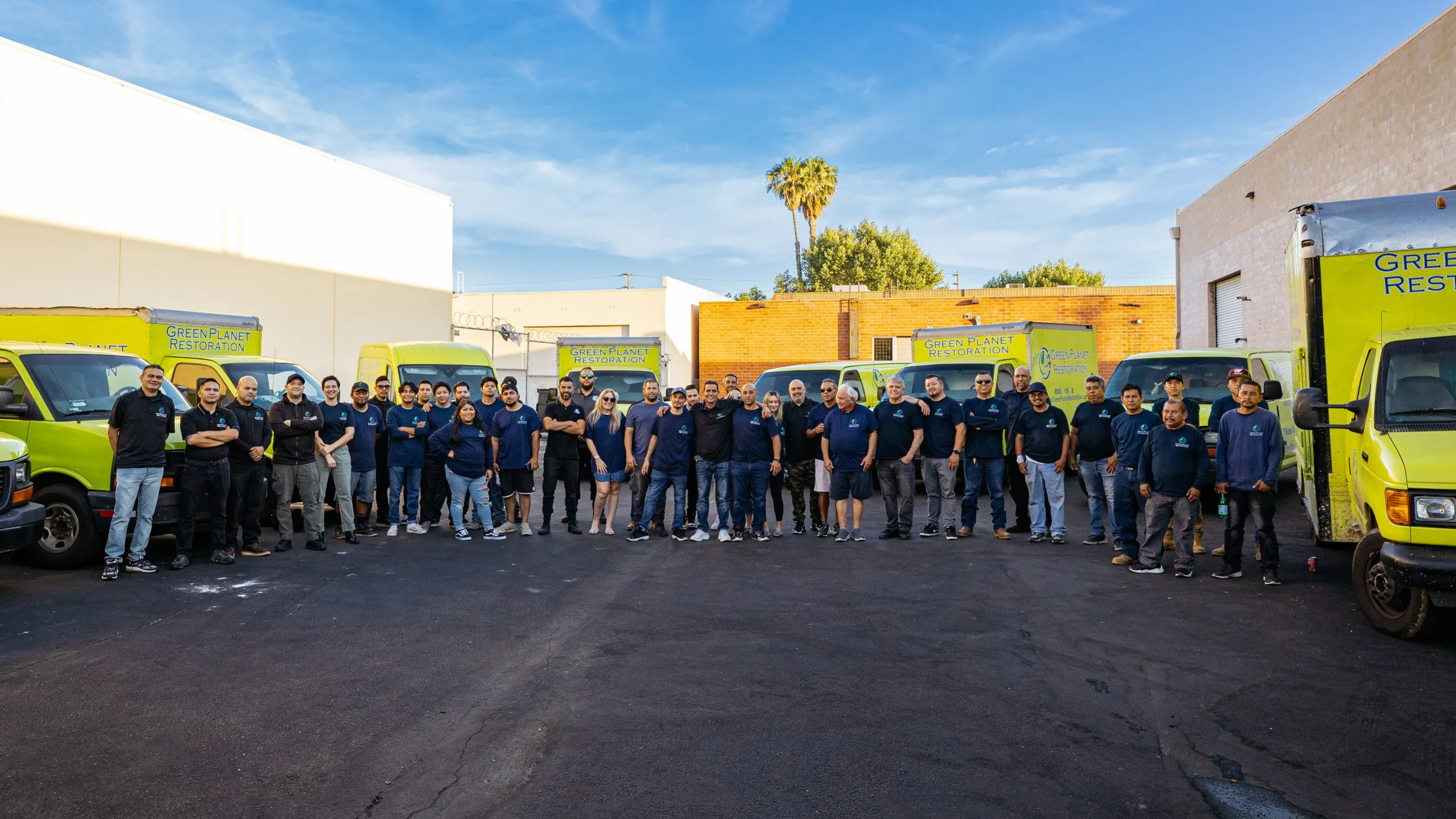 Green Planet Restoration team in the equipment yard
