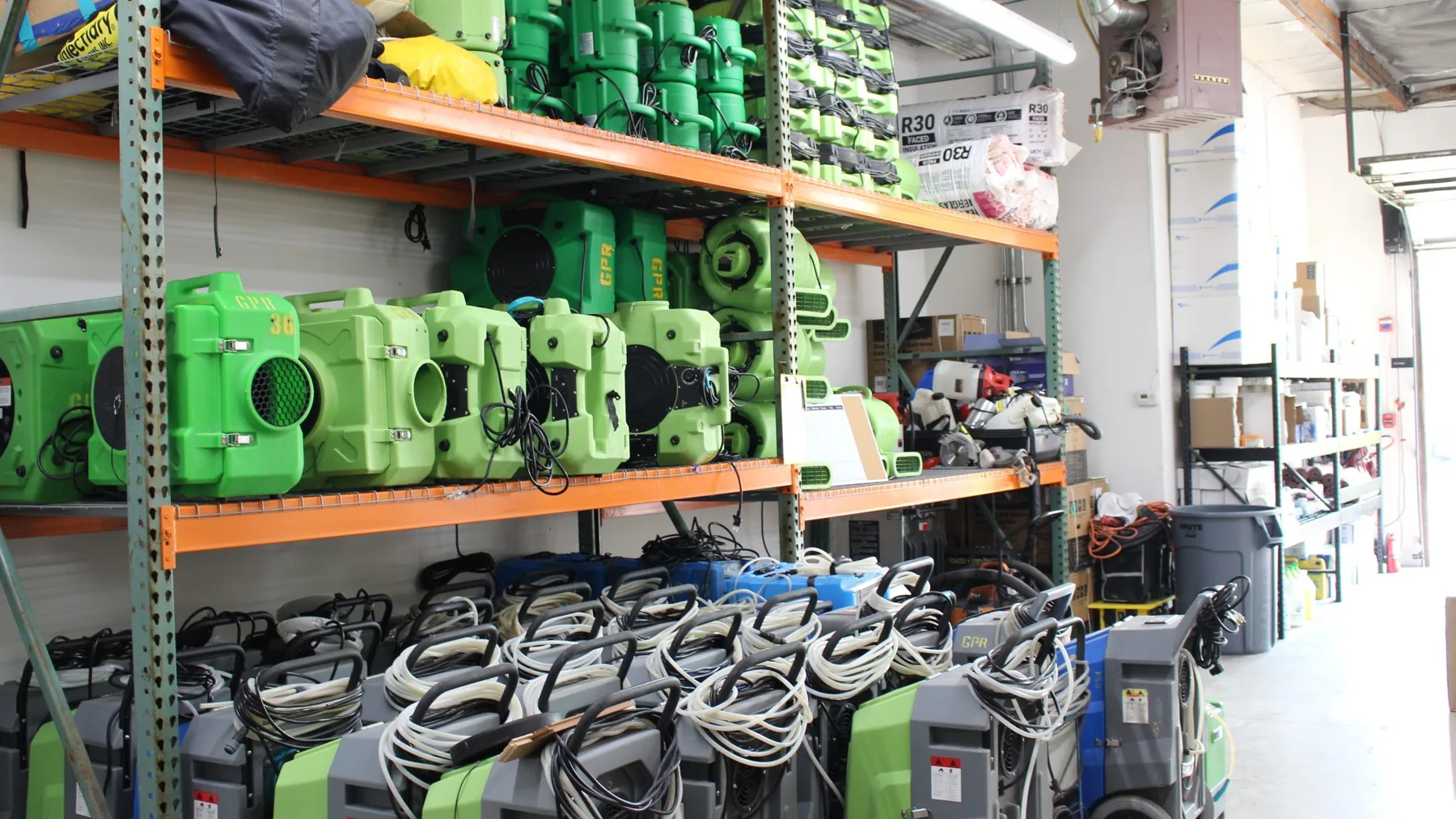 Green Planet Restoration equipment room with air movers, dehumidifiers and air scrubbers