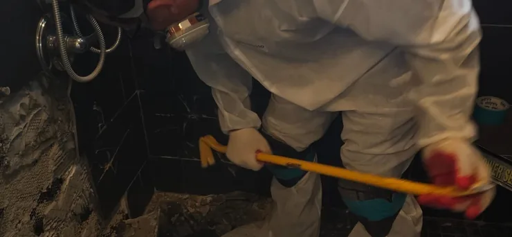 Technician cleaning a contaminated area